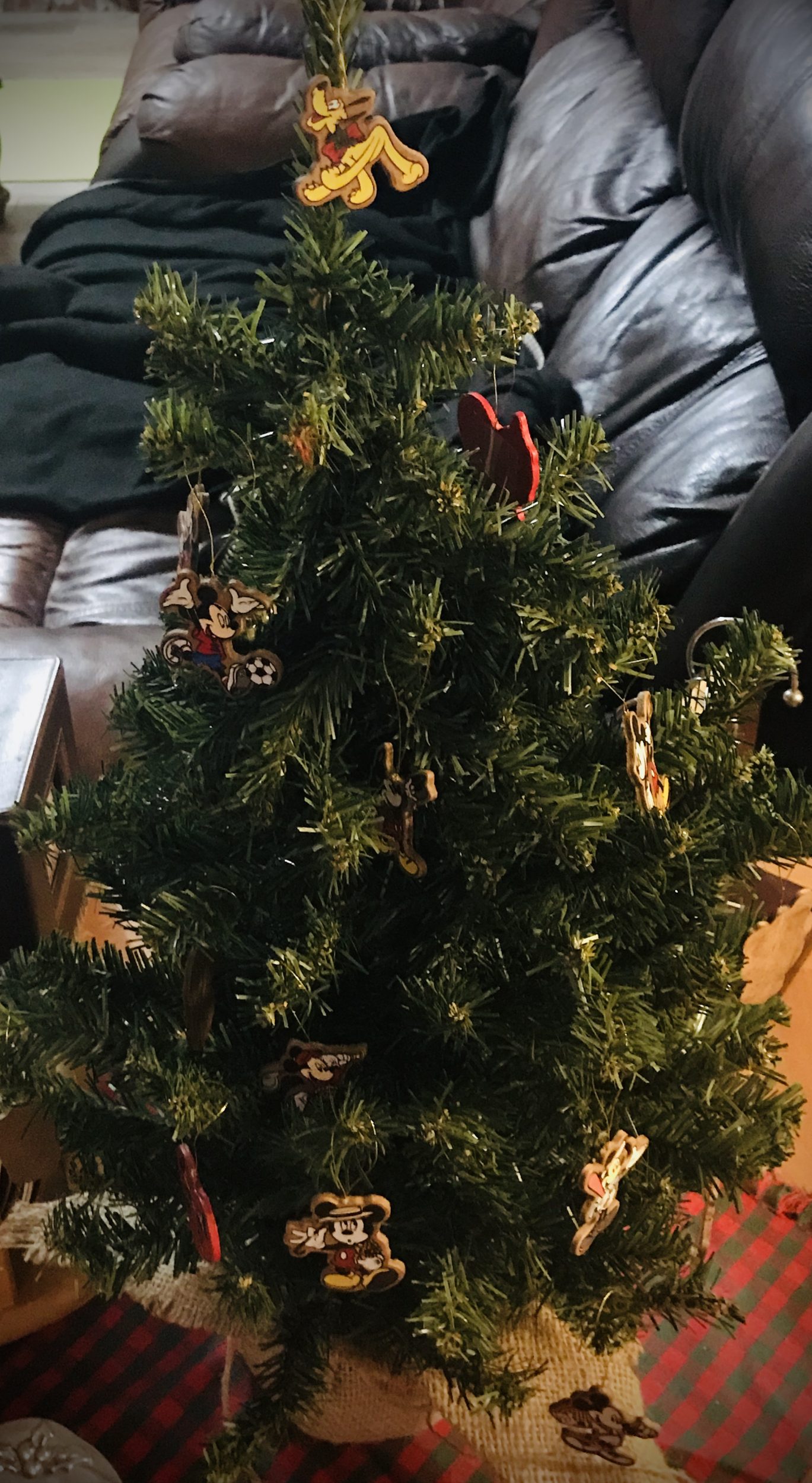 Tiny Christmas Tree with mini Disney wooden ornaments of Mickey, Minnie, Pluto, Goofy, Donald